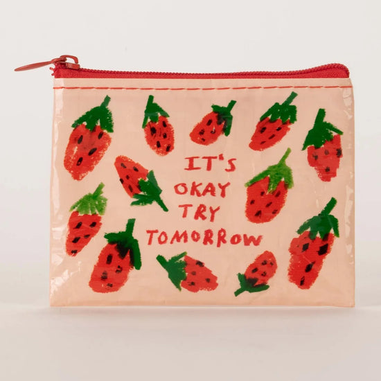Coin pouch from Blue Q with a strawberry print and motivational text design.