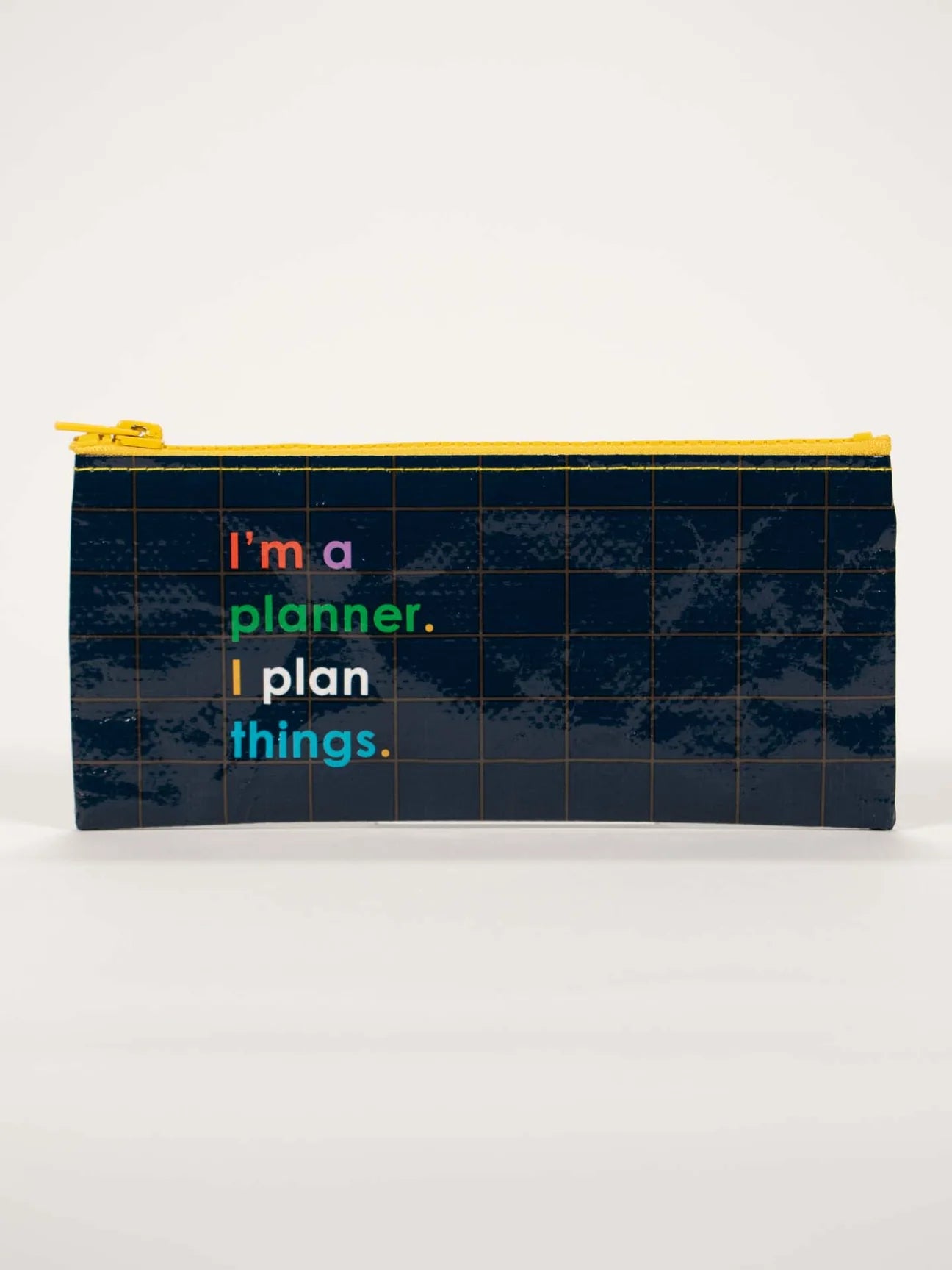 Printed pencil case by Blue Q with grid pattern and colourful text on a white background.