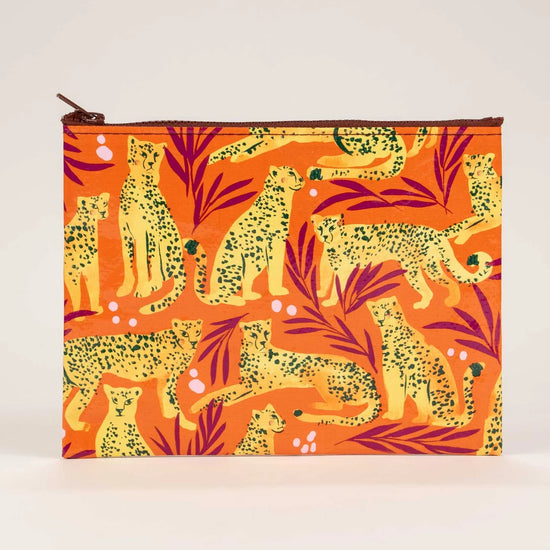 Zipper pouch by Blue Q with a cheetah and leaf pattern over orange.