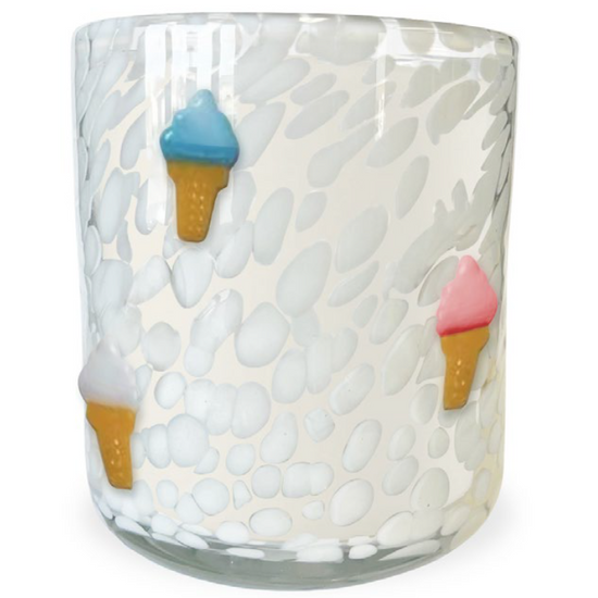 White scented candle with ice cream accents with white spotted pattern.