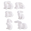 Assorted white porcelain bunnies by Creative Brands in a variety of poses.