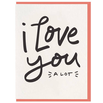 Greeting card with "I Love You" script and "a lot" detail, framed in coral.
