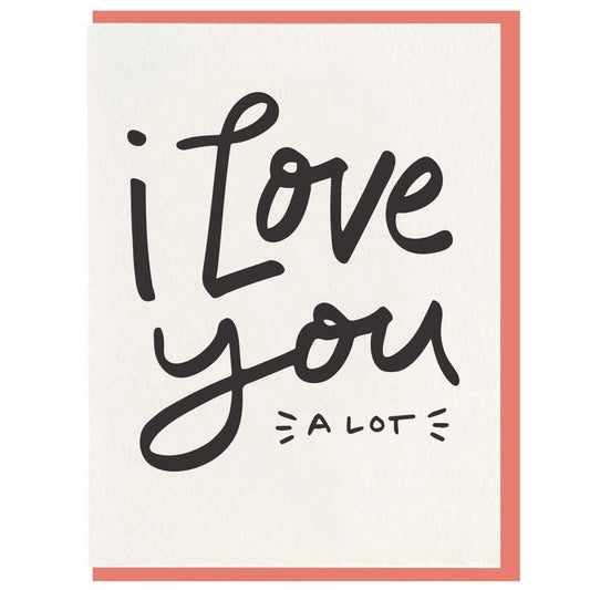 Greeting card with "I Love You" script and "a lot" detail, framed in coral.
