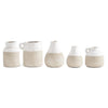 Ceramic two-tone glazed pots with beige bottoms and white tops, from an eye-level perspective.
