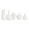 White porcelain vase by ACCORDION, with textured vertical and geometric patterns, in assorted shapes.