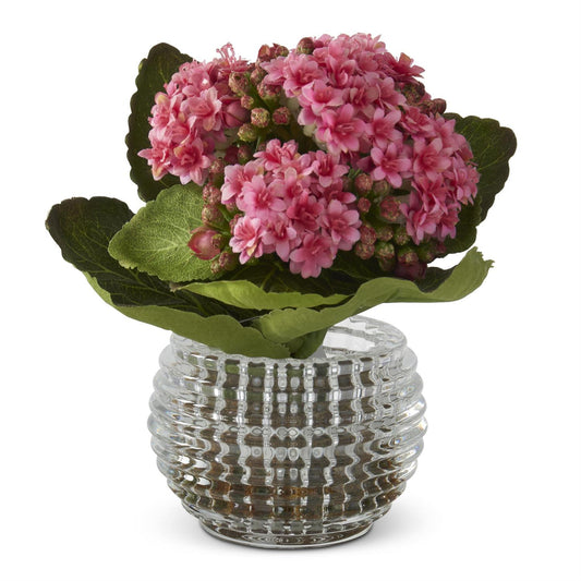 Pink kalanchoe in a pressed vase from Nearly Natural, with green leaves and decorative textured glass.
