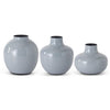 Gray enameled metal vase with black interior trim, arranged in graduating sizes.