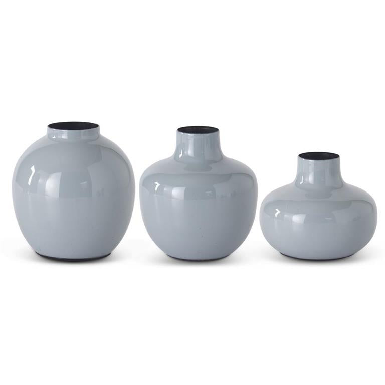 Gray enameled metal vase with black interior trim, arranged in graduating sizes.