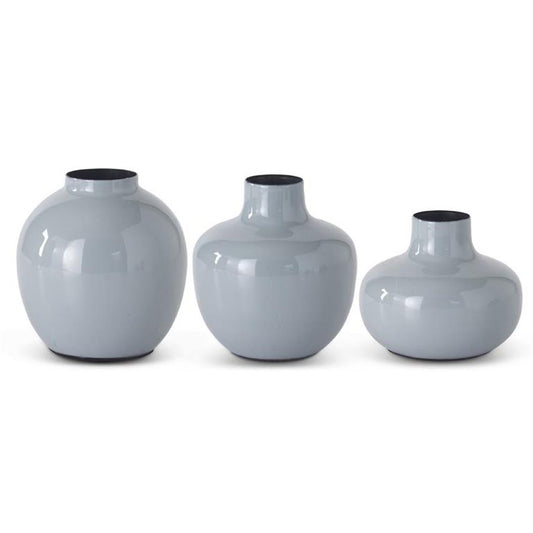 Gray enameled metal vase with black interior trim, arranged in graduating sizes.
