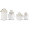 White ceramic vases with raised flower detail by Sagebrook Home, set of four in varying sizes.