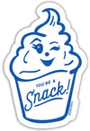 Blue and white die cut sticker by Dahlia Press featuring a cupcake character with the phrase "You're a Snack!".
