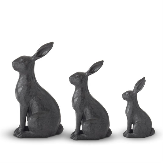 Faux cast iron rabbits by Kirklands in graduating sizes with a textured surface.
