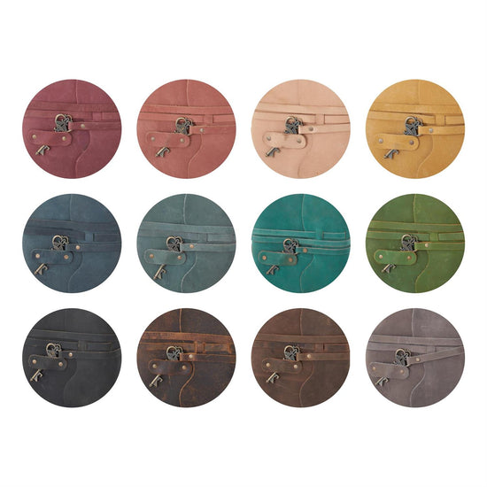 Set of round leather coasters in various colors on a white background