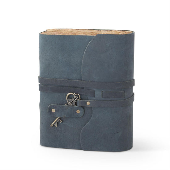 Blue leather-bound notebook with a key charm on a white background