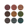Set of nine circular coasters with floral patterns in various colors on a white background