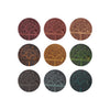 Set of nine circular coasters with tree designs in various colors on a white background