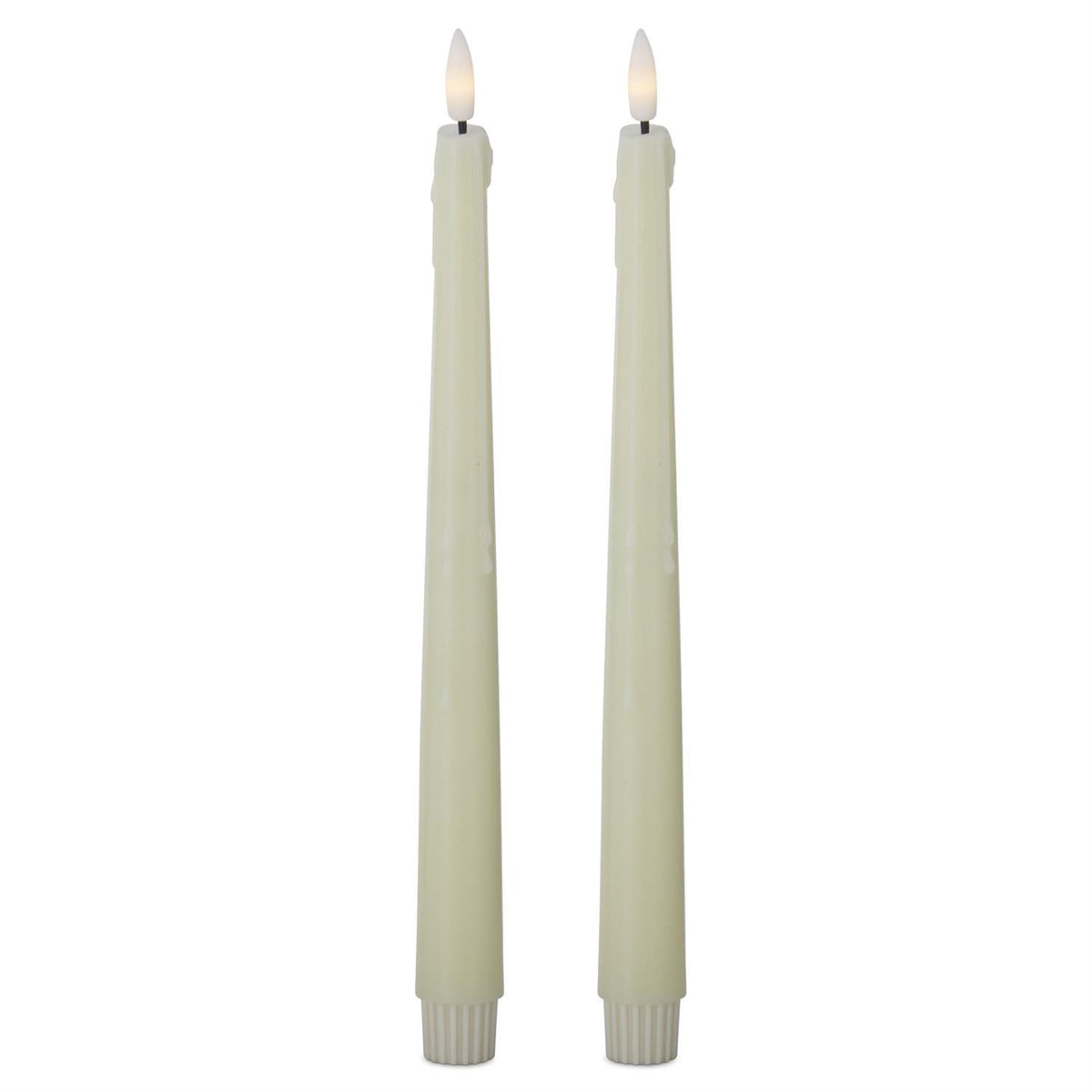 Two lit candles on a white background