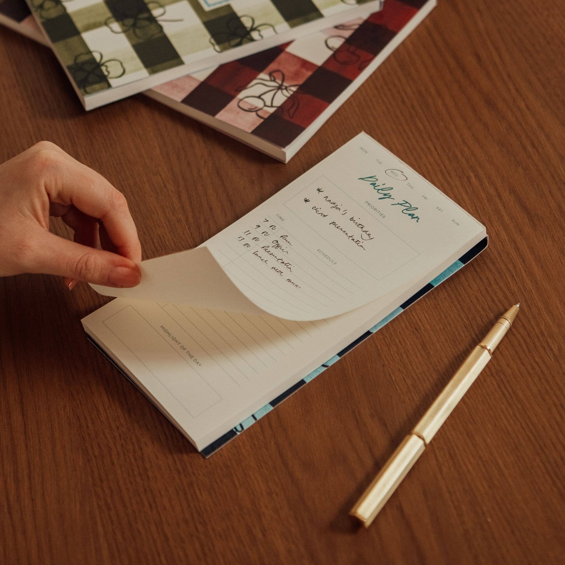 Daily planning pad from Picnic, featuring a day planner layout for prioritizing tasks and scheduling events.
