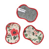 Set of three reusable sponges - flora from Roomie - with floral patterns and red trim.