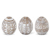 Whitewashed floral resin Easter eggs from Creative Co-op, featuring decorative flowers and leaf patterns.