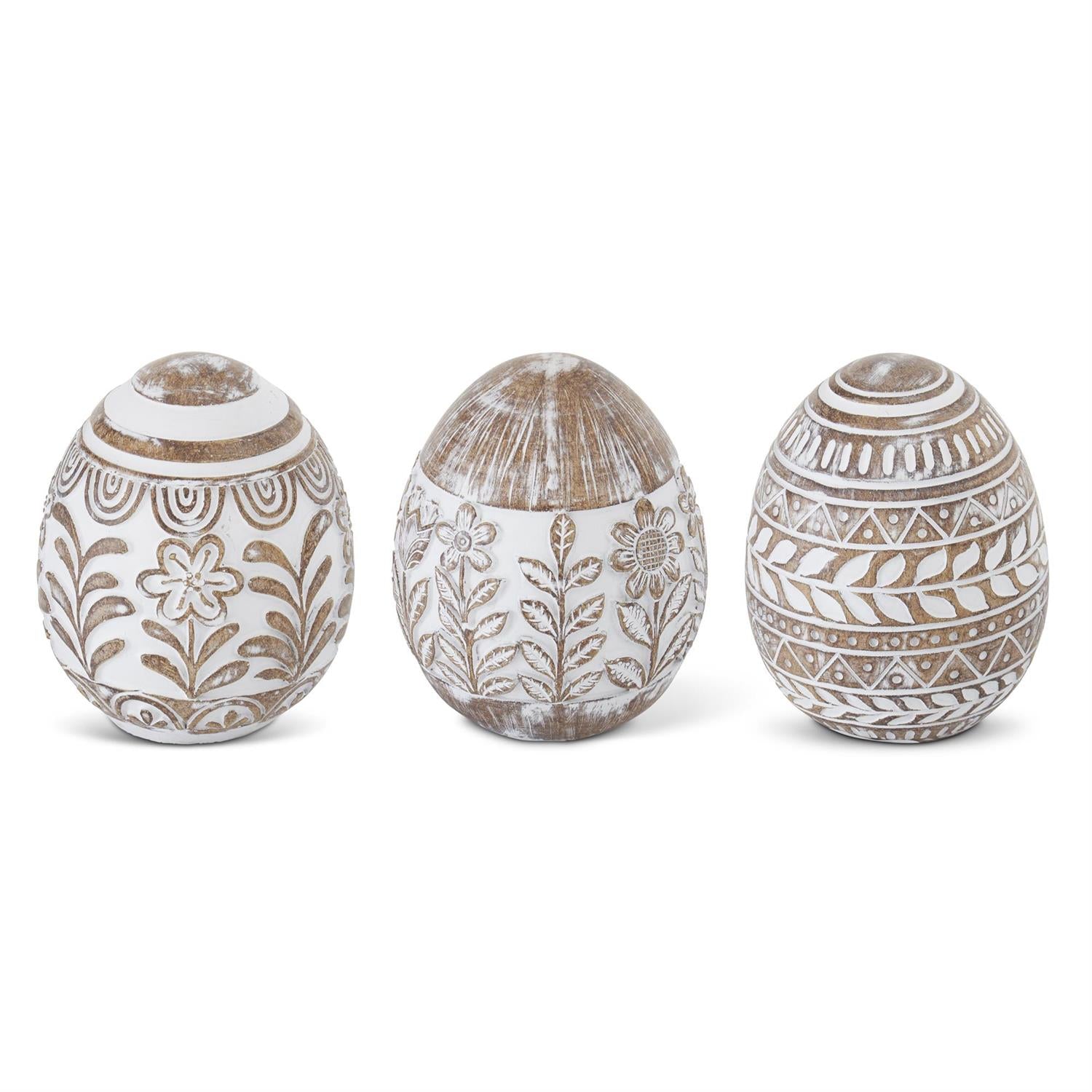 Whitewashed floral resin Easter eggs from Creative Co-op, featuring decorative flowers and leaf patterns.