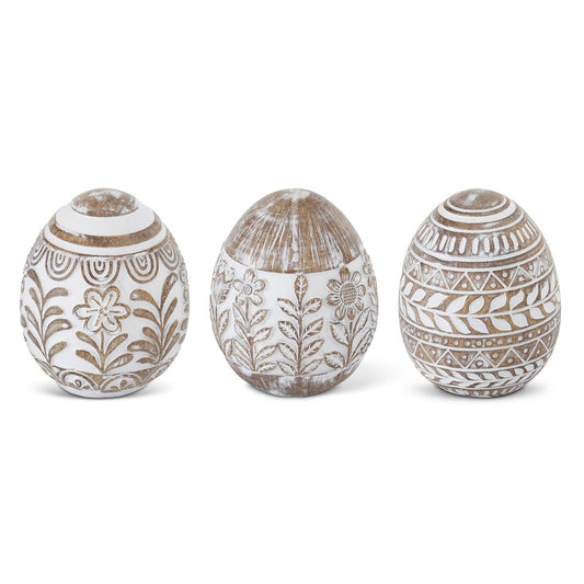 Whitewashed floral resin Easter eggs from Creative Co-op, featuring decorative flowers and leaf patterns.