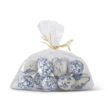 Set of blue and white patterned fabric eggs in a clear bag, tied with raffia.