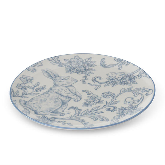 Decorative plate with Easter bunny design in blue and white.