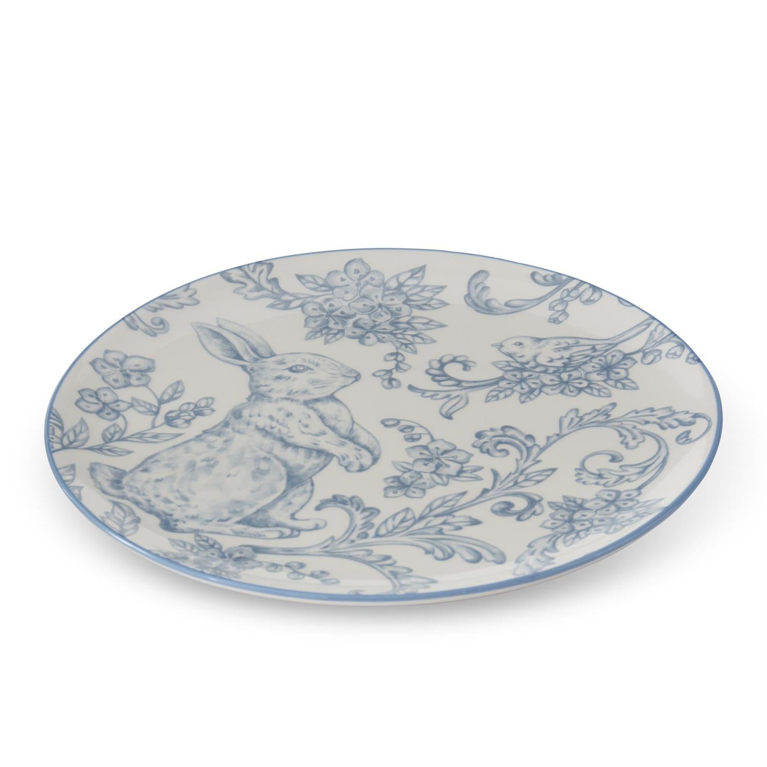 Decorative plate with Easter bunny design in blue and white.
