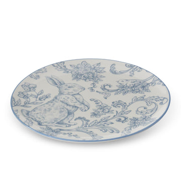 Decorative plate with Easter bunny design in blue and white.