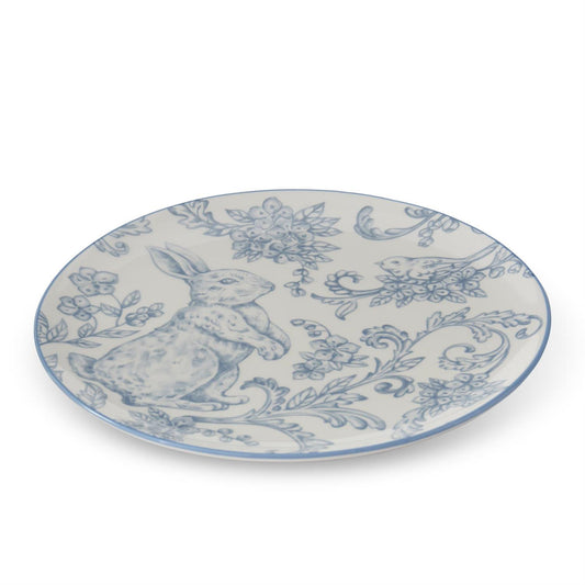 Decorative plate with Easter bunny design in blue and white.