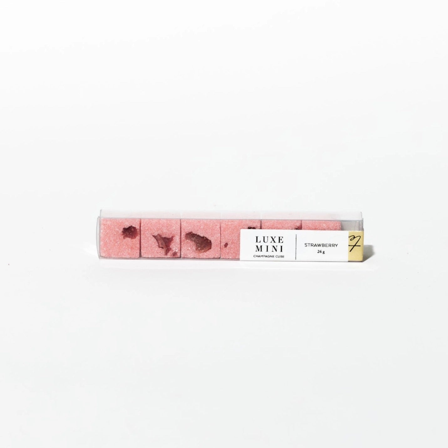 Strawberry luxe mini champagne cubes by Luxe Mini in a clear plastic container.