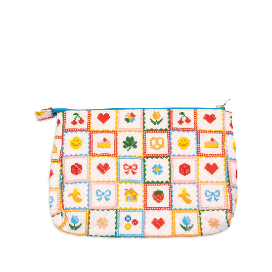 Quilted pouch by Baggu with an embroidered patchwork fruit, floral and food pattern.
