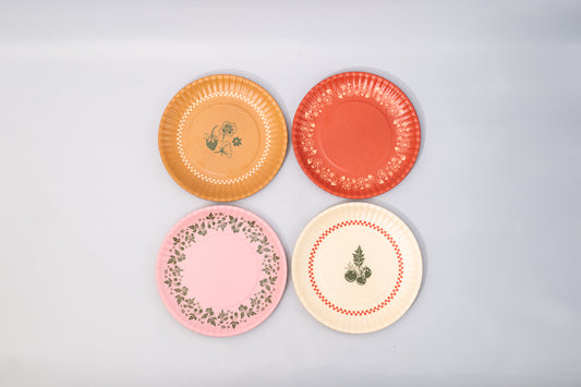 Colorful Garden Dessert Plates featuring floral and vegetable patterns in yellow, red, pink, and white.