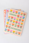 Set of three stationery notebooks with patterned covers from stationery, featuring geometric and floral designs.