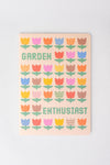 Set of three rough draft notebooks with pixelated floral pattern and lettering.