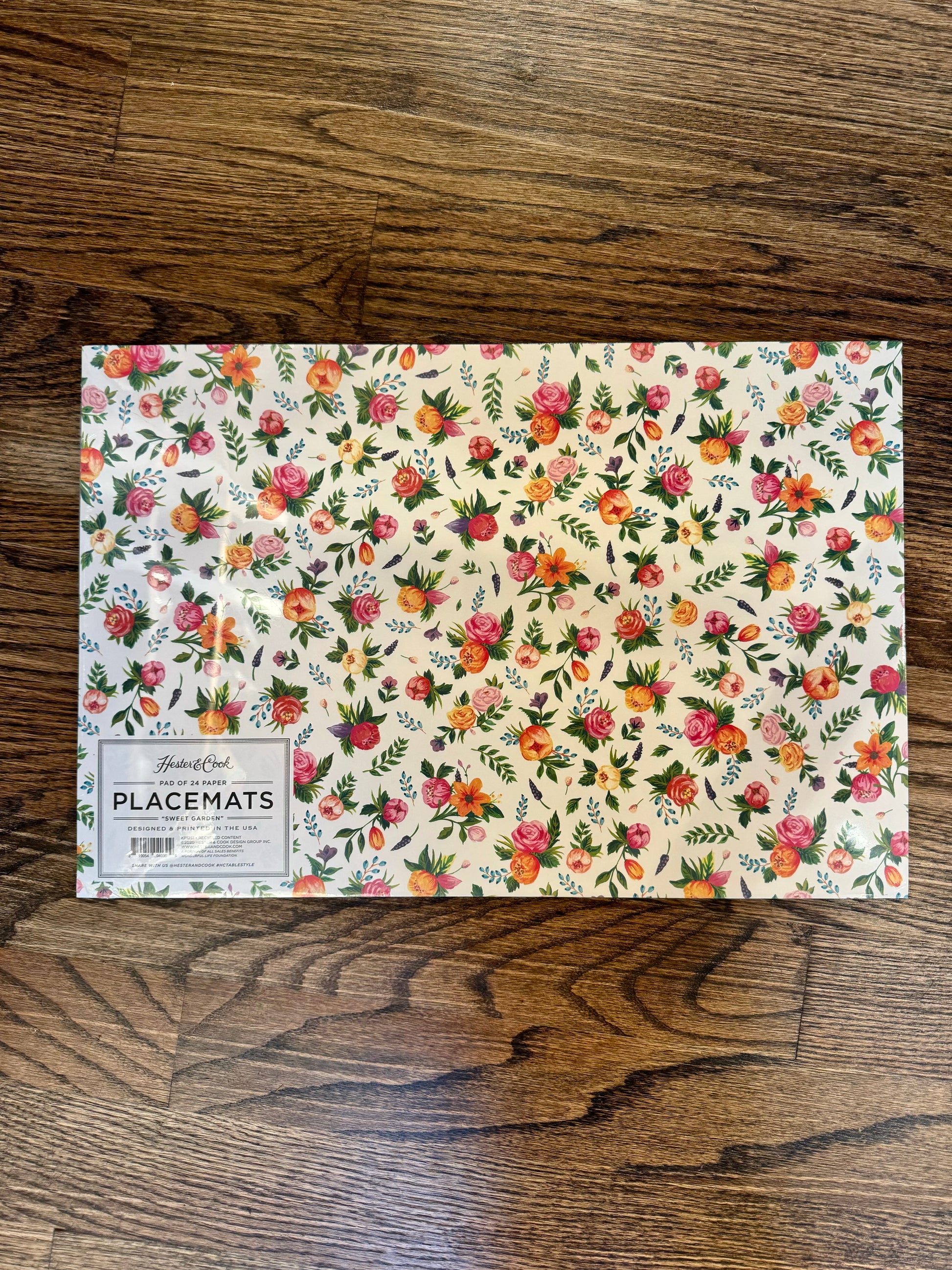 Floral paper placemat by Hester & Cook, featuring a charming "Sweet Garden" pattern.