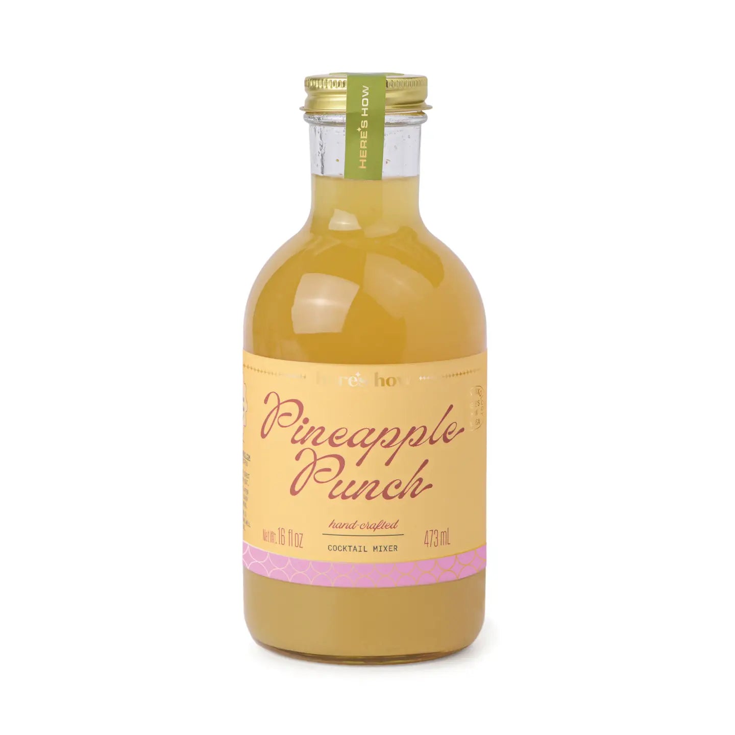 Pineapple punch cocktail mixer from Here's How, in a glass bottle with a gold cap and label.