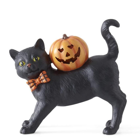 Black cat figurine with a pumpkin on its back against a white background
