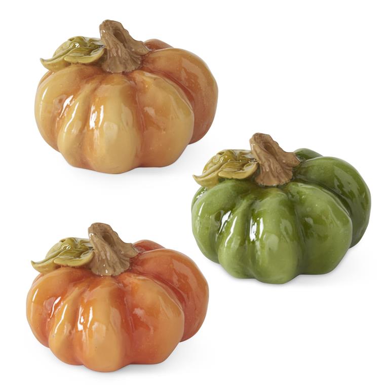 Set of three resin pumpkins by Park Designs in orange, gold and green with glossy finish.