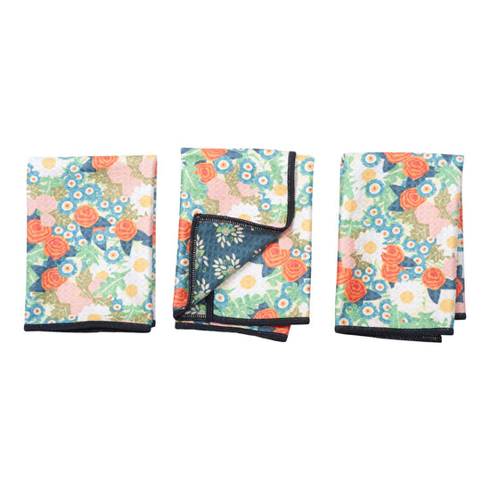 Set of three mini reversible towels with floral calico pattern by ME, featuring a dark border.
