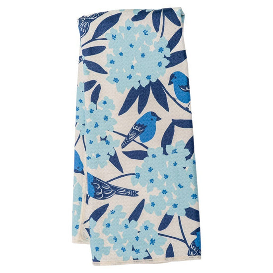 Reversible navy towel by Peking Handicraft with a light blue floral and bird pattern.