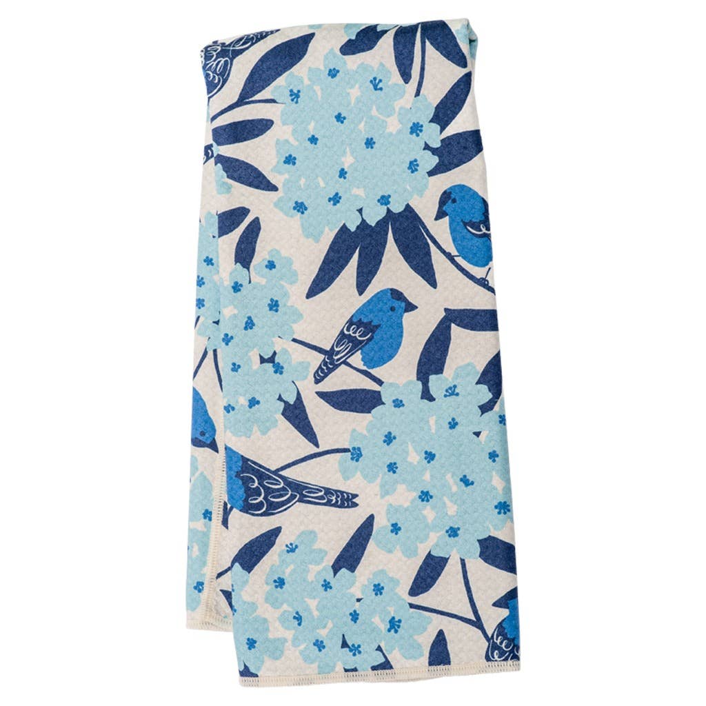 Reversible navy towel by Peking Handicraft with a light blue floral and bird pattern.