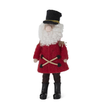 Wool Santa soldier by Raz Imports with a black hat, red coat, and crossed wood accents.