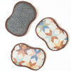 Set of three reusable sponges with star and cube quilt patterns, multicolor design.