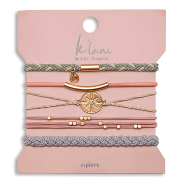 Gold charm hair tie and bracelet set by K'lani, with braided, beaded and compass charm details.