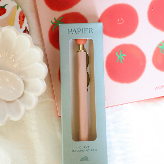 Ballpoint pen in a 'PAPIER' box with a decorative background