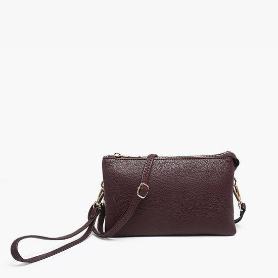Sangria crossbody wristlet from Sangria with gold-toned hardware and pebbled texture.