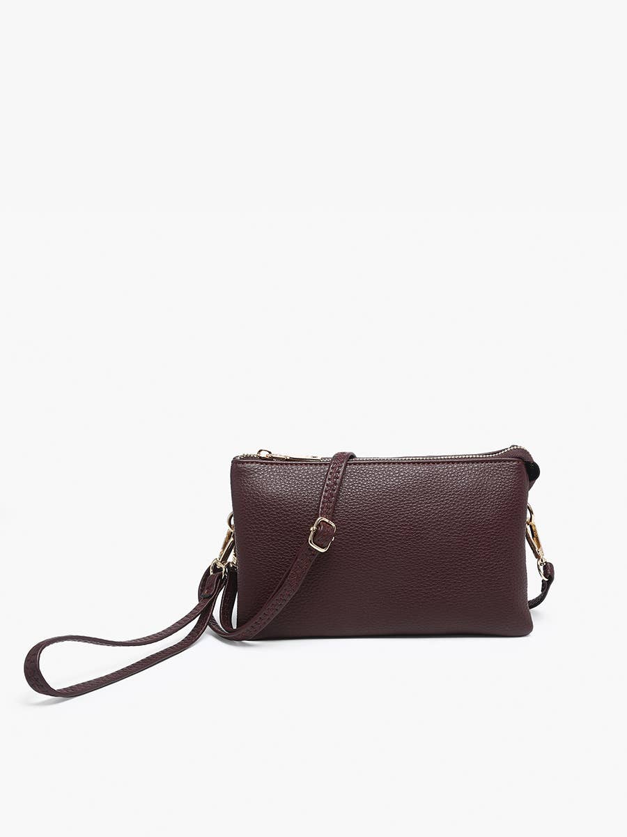 Sangria crossbody wristlet from Sangria with gold-toned hardware and pebbled texture.