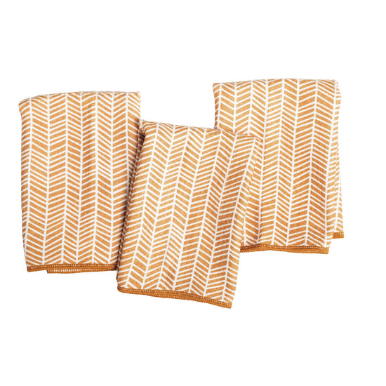 Set of three mini towels with a branches pattern in gold, featuring a hemmed edge.
